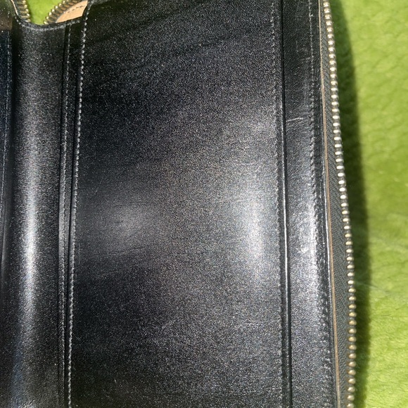 Dooney and Bourke zip along wallet in solid black. - Picture 11 of 12